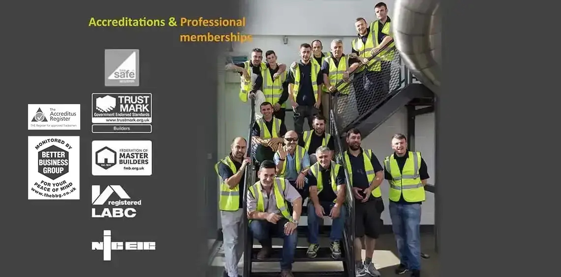 a group of men in safety vests posing for a picture